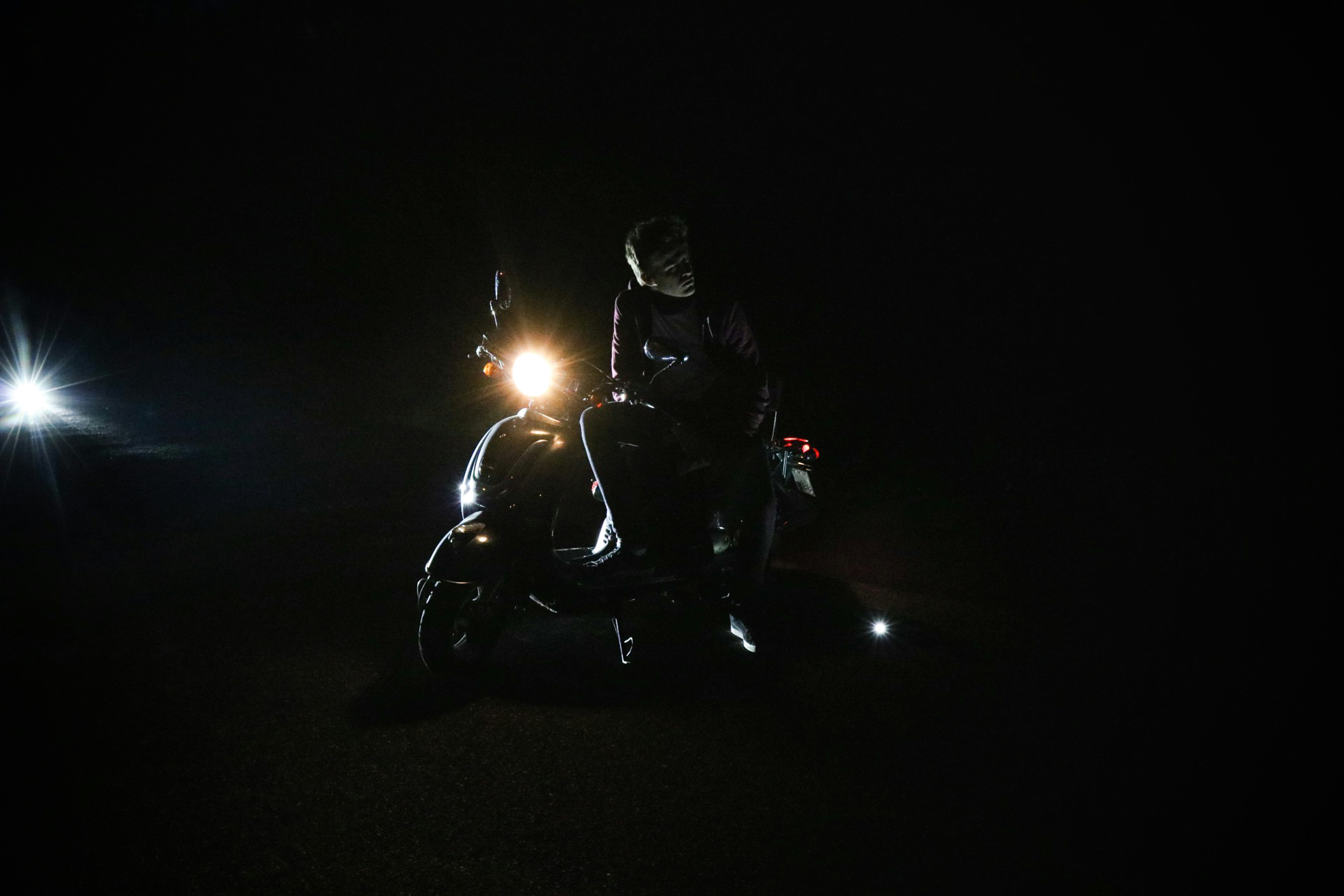 person sitting on motorcycle